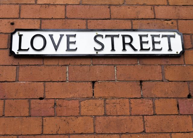 Love Street Sign on a red brick wall
