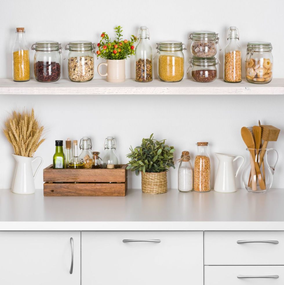 <p>Make room for things to be put away and leave open shelves free to house only the most loved objects. Having the things you need to hand can help you create a mindful display that is both functional and beautiful. Jars of healthy pulses and wholegrains next to stacks of handcrafted ceramics also remind you to look after yourself and your body.</p><p><em data-redactor-tag="em"><a href="https://www.housebeautiful.com/uk/decorate/kitchen/news/g423/best-kitchen-design-trends/" target="_blank">Read more on open shelving and hidden storage in the kitchen</a></em>.</p>