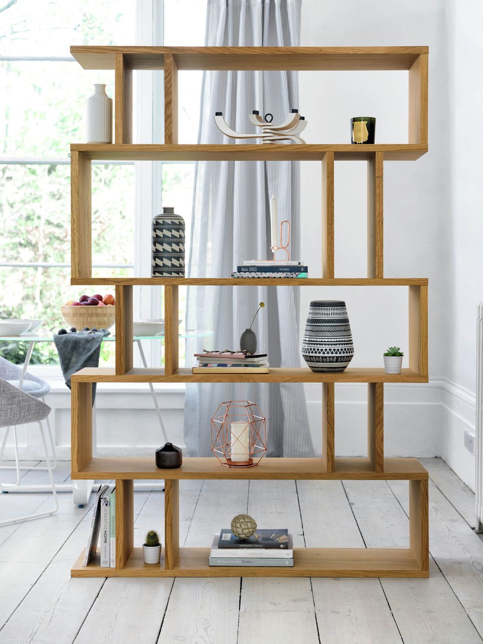 <p>Finished with rich, lightly oiled oak veneers, this linear design is versatile, practical and beautiful to look at.</p><p><strong data-redactor-tag="strong">Content by Conran Elmari Tall Shelving, £599, Furniture Village <a href="https://www.furniturevillage.co.uk/elmari-tall-shelving/ZFRSP000000000021249.html" class="body-btn-link" target="_blank">BUY NOW</a></strong></p>