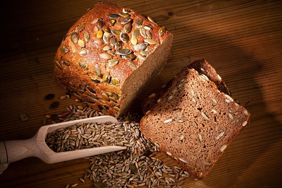 Bread, Wood, Brown bread, Food, Ingredient, Loaf, Baked goods, Rye bread, Hardwood, Cuisine, 
