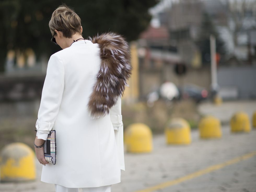 Yellow, Street fashion, Winter, Drink, Back, Fur, Bag, Fur clothing, Natural material, Water bottle, 