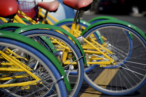 Bicycle tire, Bicycle wheel rim, Yellow, Spoke, Rim, Bicycle wheel, Bicycle, Bicycle accessory, Synthetic rubber, Bicycle handlebar, 