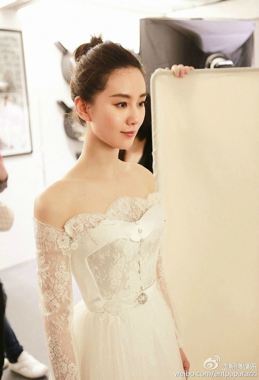 Hairstyle, Sleeve, Shoulder, Dress, Bridal clothing, Gown, Picture frame, Style, Strapless dress, Wedding dress, 
