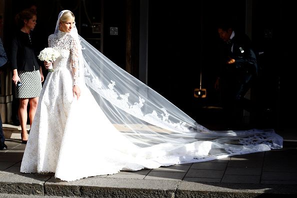 Bridal veil, Bridal clothing, Veil, Dress, Gown, Formal wear, Bride, Wedding dress, Bridal accessory, Tradition, 