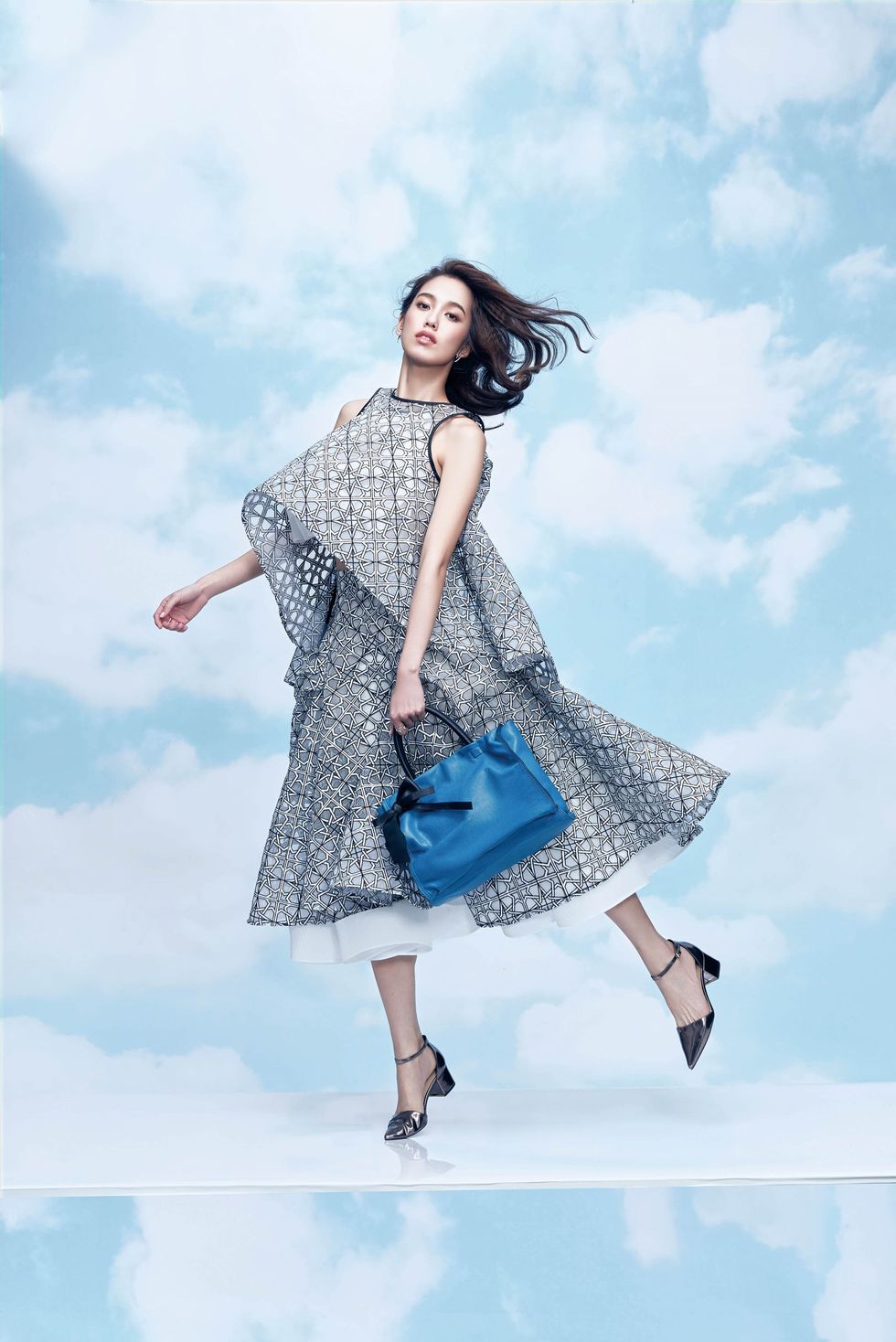 Blue, Sleeve, Shoulder, Cloud, Textile, Joint, Human leg, Pattern, One-piece garment, Dress, 