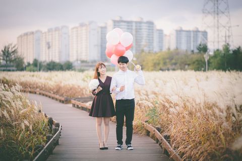 Photograph, Dress, Balloon, People in nature, Coat, Interaction, Love, Walkway, Tower block, Grass family, 