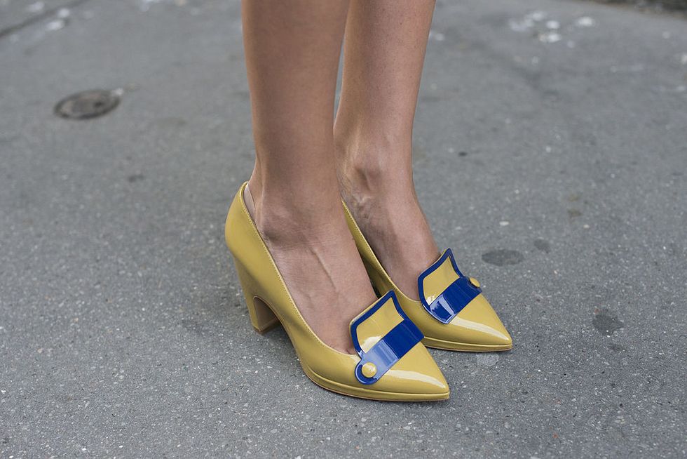 Yellow, Human leg, Road surface, Asphalt, Tan, Close-up, Foot, Calf, High heels, Sandal, 
