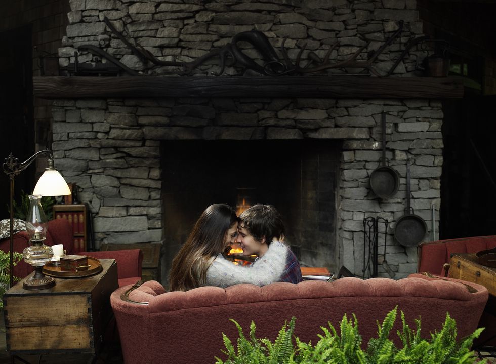 Long hair, Love, Hearth, Lamp, Living room, Fireplace, Home accessories, Romance, Brick, Couch, 