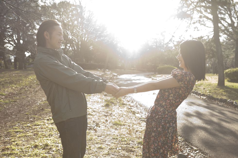 Tree, Standing, People in nature, Sunlight, Dress, Interaction, Gesture, Holding hands, Friendship, Morning, 