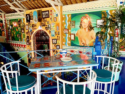 Table, Majorelle blue, Guru, Temple, Sculpture, Houseplant, Flowerpot, Outdoor table, Place of worship, Mythology, 
