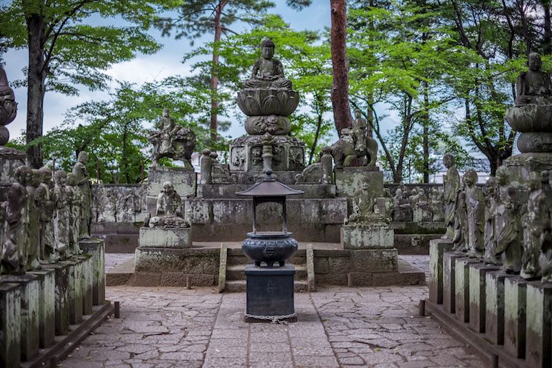 Historic site, Temple, Stone carving, Monument, Sculpture, Carving, Artifact, Ancient history, Cobblestone, Landscaping, 