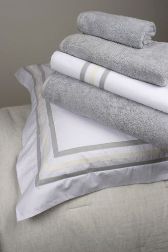 White, Towel, Textile, Linens, Bed sheet, Bedding, Room, Duvet cover, Interior design, Furniture, 