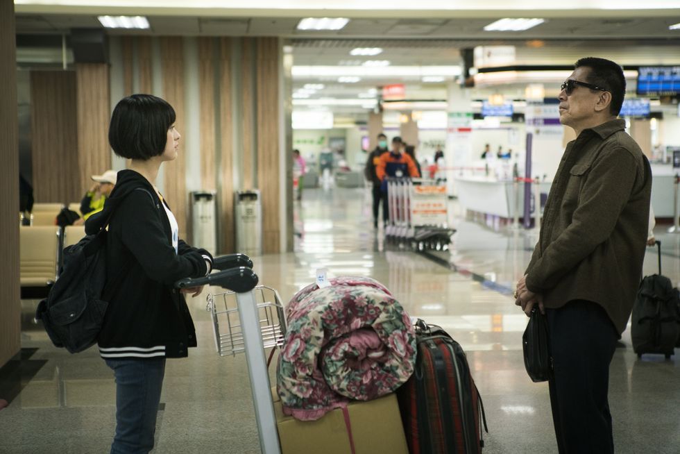 Snapshot, Baggage, Urban area, Standing, Human, Infrastructure, Event, Luggage and bags, Building, Customer, 