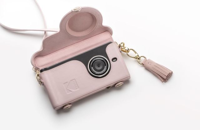 Pink, Fashion accessory, Pendant, Camera, Material property, Necklace, Jewellery, Chain, Locket, Strap, 