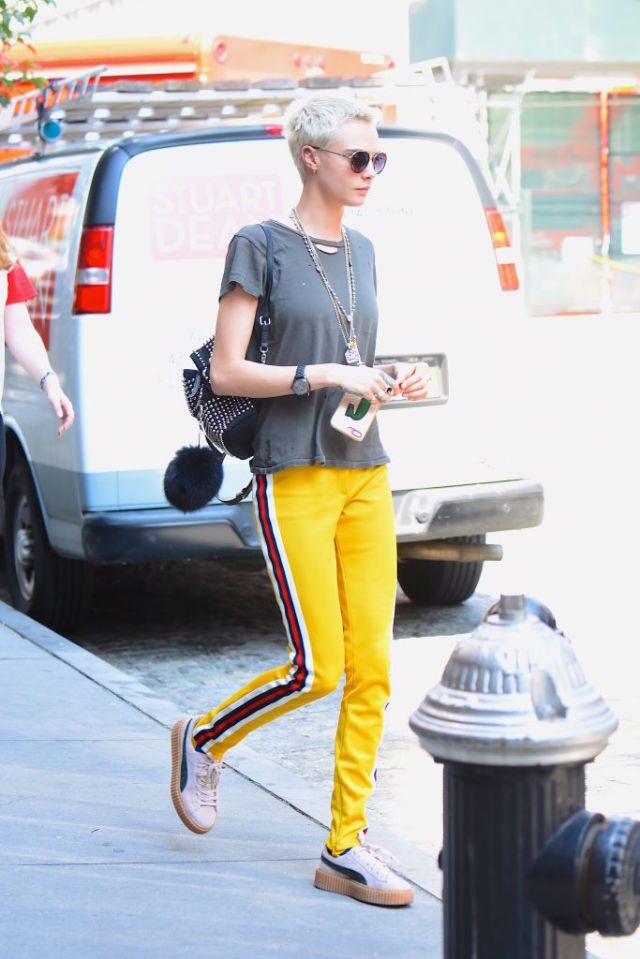 Yellow, Street fashion, Sportswear, Sunglasses, Fashion, Footwear, Textile, Leg, Trousers, Eyewear, 