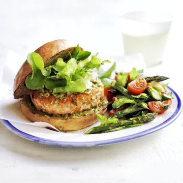 pesto salmon burgers with asparagus and tomato salad