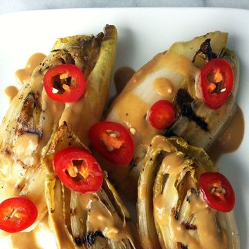 grilled endive with peanut sauce and chilies