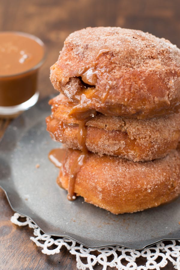<p>"Dulce de Leche" makes us feel real fancy, but these doughnuts are ridiculously simple! The secret is Pillsbury Grands biscuits. Just fry these babies in a skillet, pump them with caramel sauce, then dust with powdered sugar and cinnamon. The look <em>and</em> taste is totally pro-level. </p>
<p>Get the recipe from <a target="_blank" href="http://www.ohsweetbasil.com/dulce-de-leche-churro-donuts-recipe.html">Oh Sweet Basil</a>.</p>
