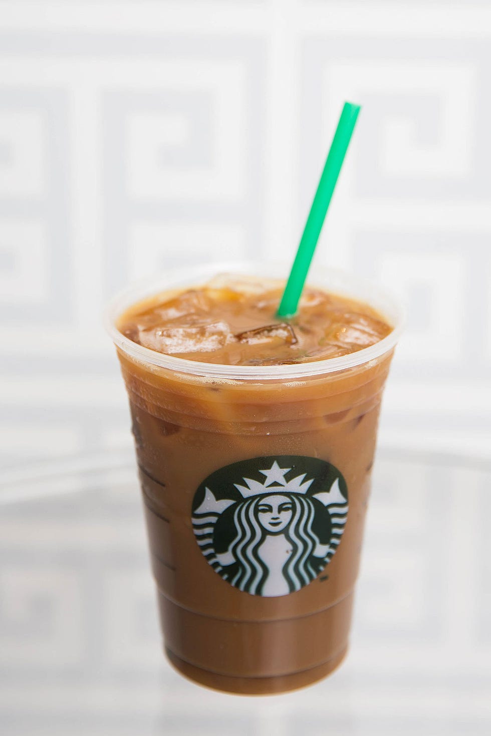 Brown, Drinking straw, Drink, Coffee, Logo, Ingredient, Non-alcoholic beverage, Tan, Fast food, Liver, 
