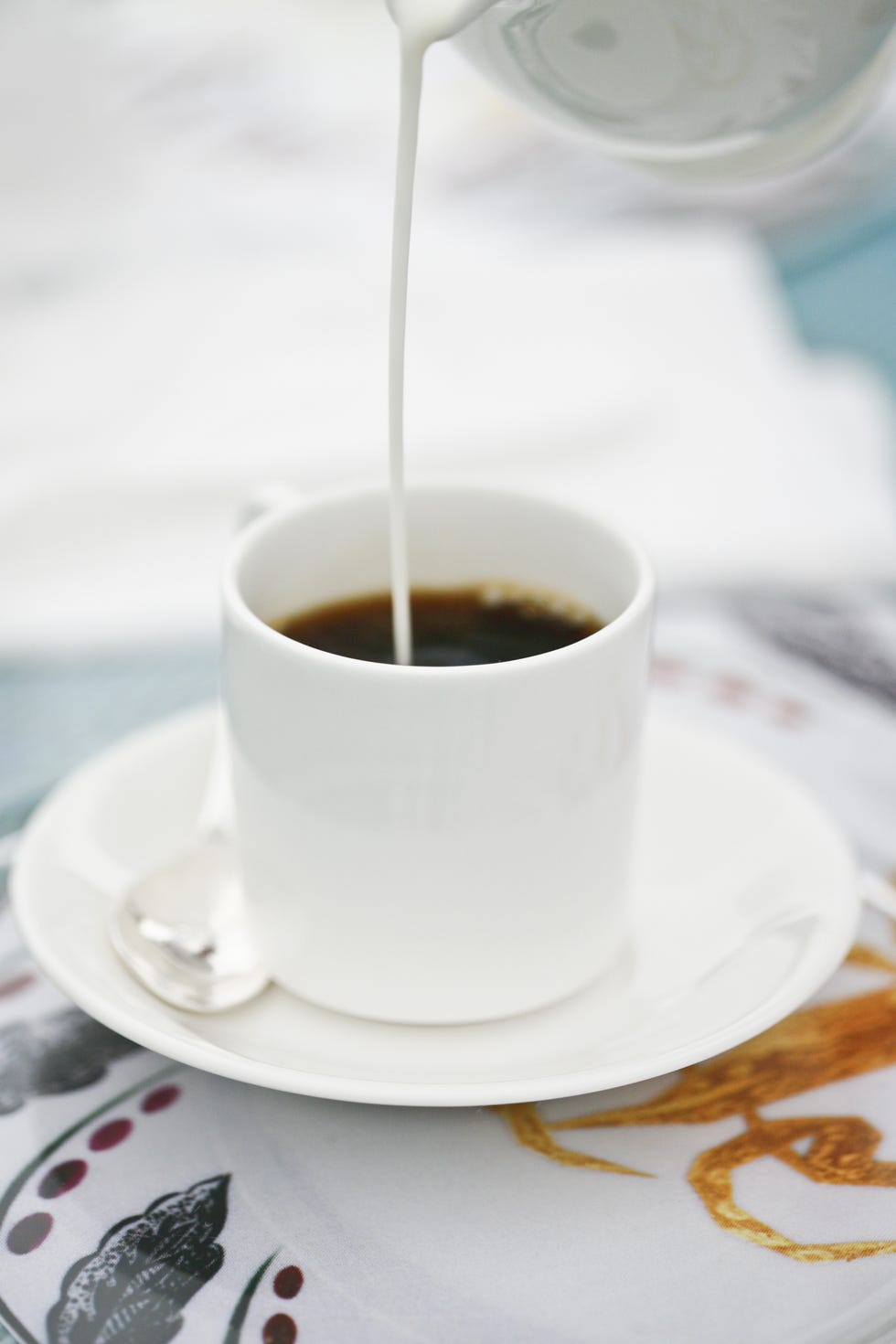 cream poured into a coffee mug
