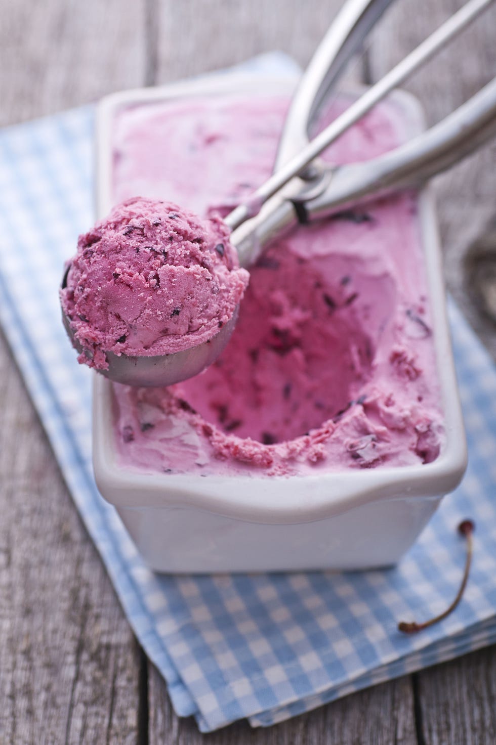 pan of cherry gelato with a scoop