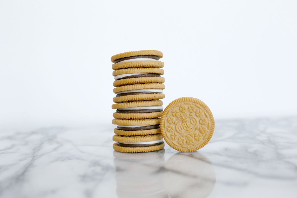 Finger food, Currency, Metal, Cookies and crackers, Money, Saving, Still life photography, Biscuit, Baked goods, Brass, 