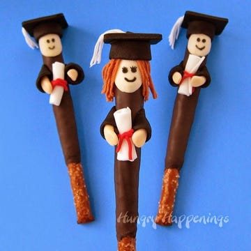 Brown, Toy, Style, Costume accessory, Costume hat, Fictional character, Lego, Axe, Nutcracker, Figurine, 