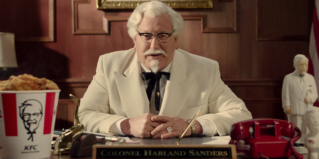Eyewear, Vision care, Glasses, Coat, Suit, Picture frame, Sitting, Tie, Blazer, Fried food, 