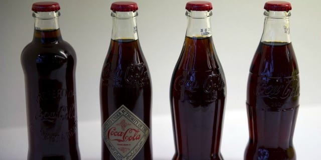 Product, Bottle, Glass bottle, Liquid, Red, Glass, Drink, Alcoholic beverage, Carmine, Maroon, 