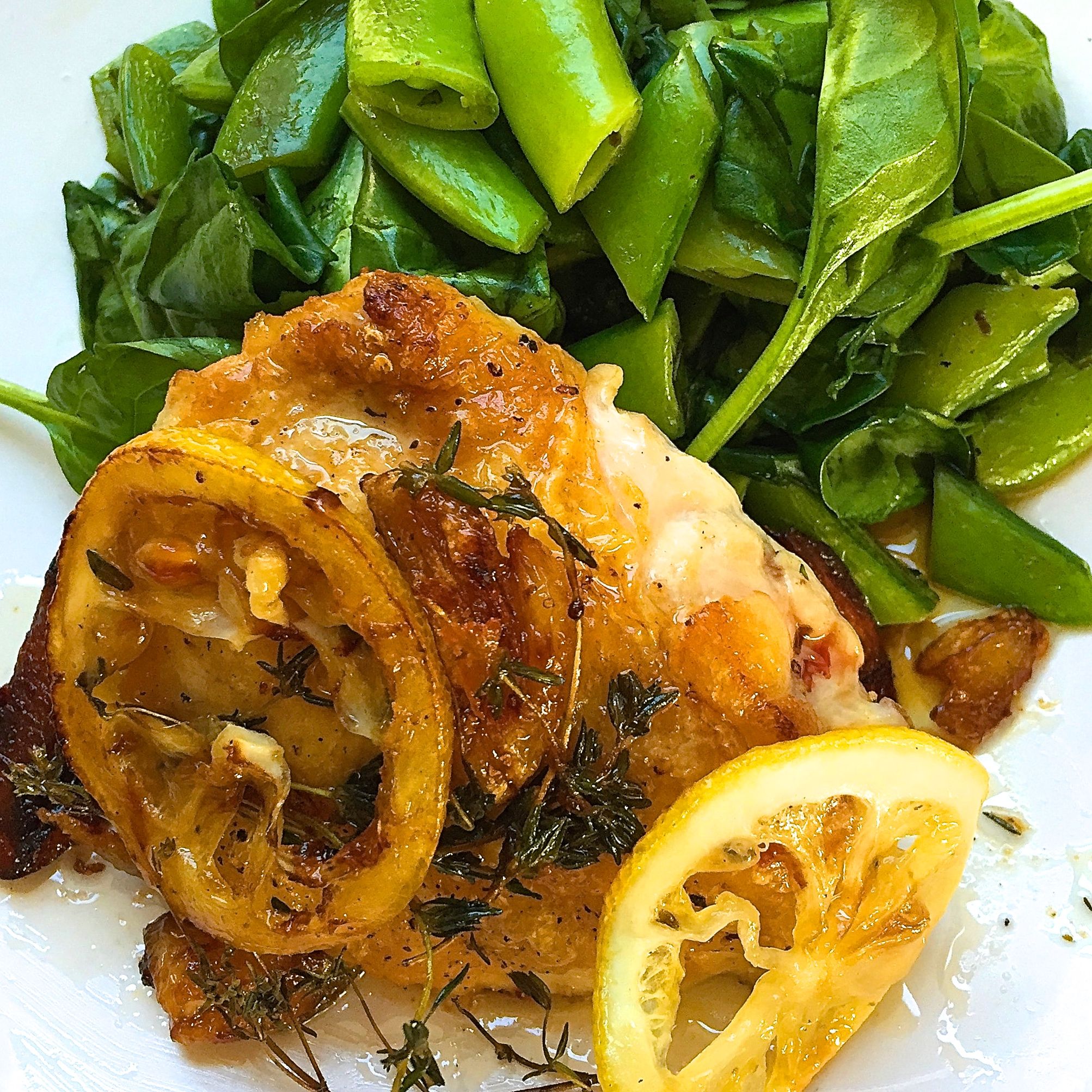 Lemon Garlic Pan Roasted Chicken Thighs With Spinach And Snap Peas Recipe Delish Com