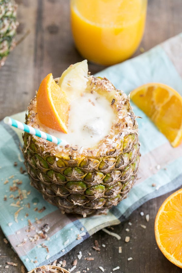 Pineapple Cup Piña Colada <p>This isn't your standard piña colada. Made with orange juice, dark rum, coconut rum, and the pineapple puree from the cut-out center, you won't want to waste a drop of this drink!</p>
<p>Get the recipe at <a target="_blank" href="http://sugarandcharm.com/2014/05/toasted-coconut-pineapple-cocktail-pineapple-cup.html/">Sugar and Charm</a>.</p>
