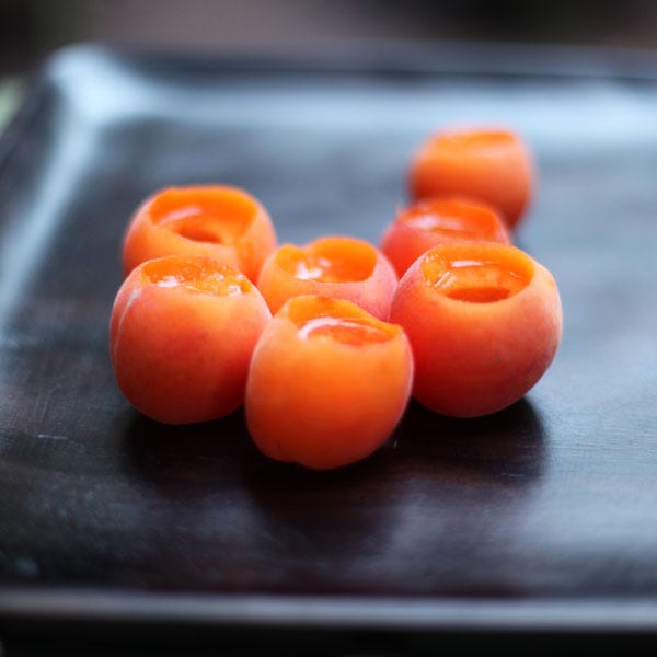 <p>Press the center of an apricot out using the cap from any old bottle you may have. Then pour in your favorite alcohol and enjoy.</p>
<p>Get the recipe at <a target="_blank" href="http://mightygirl.com/2012/07/03/mighty-thirst-shots-in-cots/">Mighty Girl</a>.</p>
