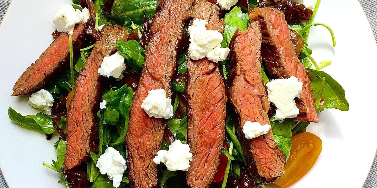 Grilled Skirt Steak Salad with Arugula, Balsamic-Glazed Onions, Tomatoes, and Feta
