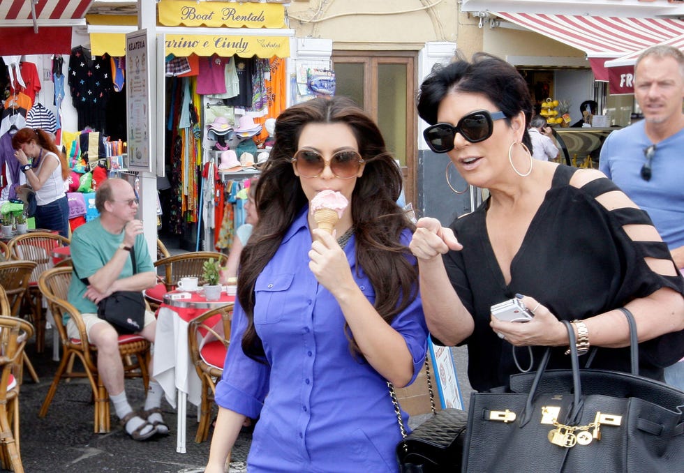Kim's more into the ice cream than whatever Kris is pointing at.