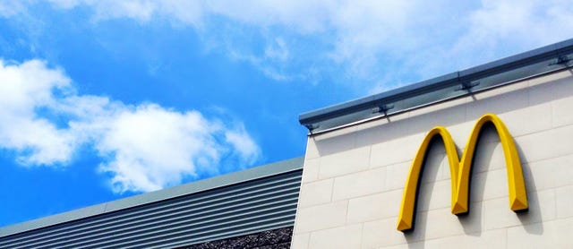 McDonald's Signage Against Blue Sky