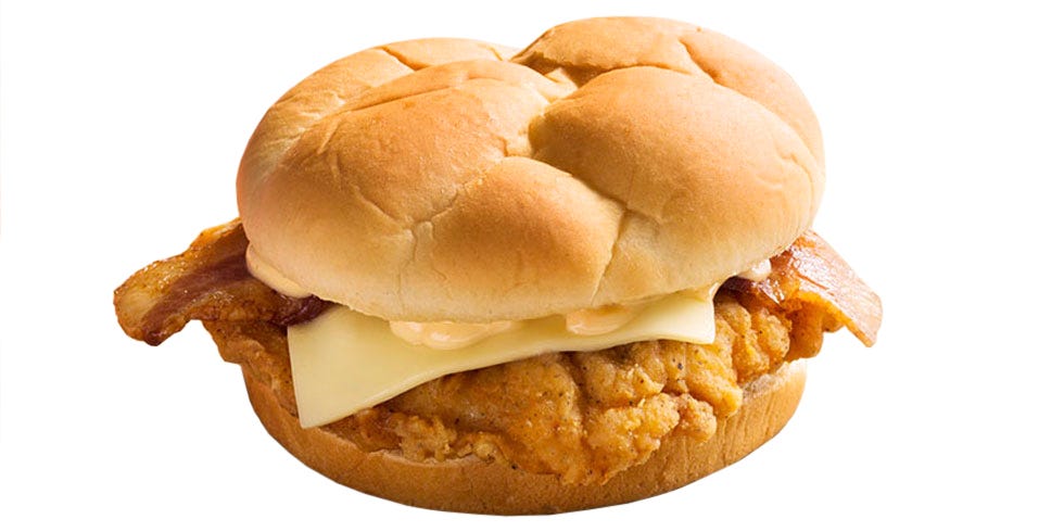 <p><strong>Official Menu Description: </strong>"Mankind's greatest foods combined: a boneless breast filet of the Colonel's Original Recipe covered with bacon, topped with Monterey Jack and sauce and served on a sweet Hawaiian bun."—<a href="http://www.kfc.com/" target="_blank"><em>KFC's website</em></a><strong></strong></p><p><strong></strong><strong>Verdict:</strong> Sweet Hawaiian bun indeed. We probably should have been better prepared for the sweetness of the bun, and it definitely stood out, just not in a good way. The chicken has that classic KFC spice, which we can't resist, plus the cheese and bacon win points for showing up. Pretty standard, if not solid. </p>