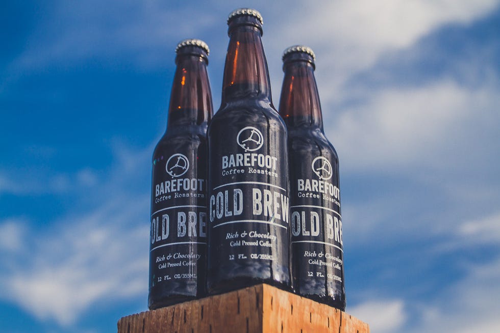 Brown, Liquid, Glass bottle, Bottle, Beer bottle, Drink, Alcohol, Alcoholic beverage, Beer, Logo, 