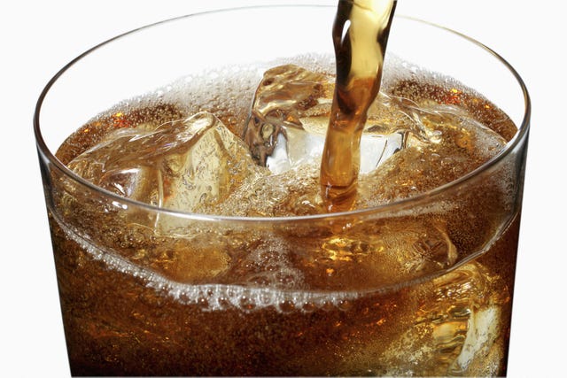 soda pouring in glass