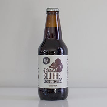 Glass bottle, Brown, Product, Bottle, Drink, White, Alcoholic beverage, Liquid, Font, Logo, 