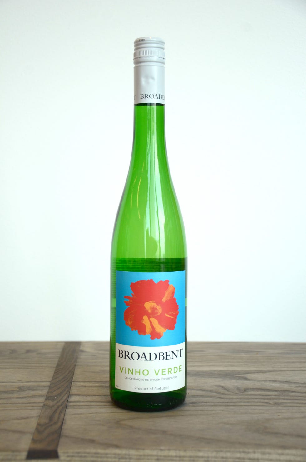 Product, Bottle, Green, Glass bottle, Wood, Ingredient, Alcoholic beverage, Logo, Hardwood, Drink, 