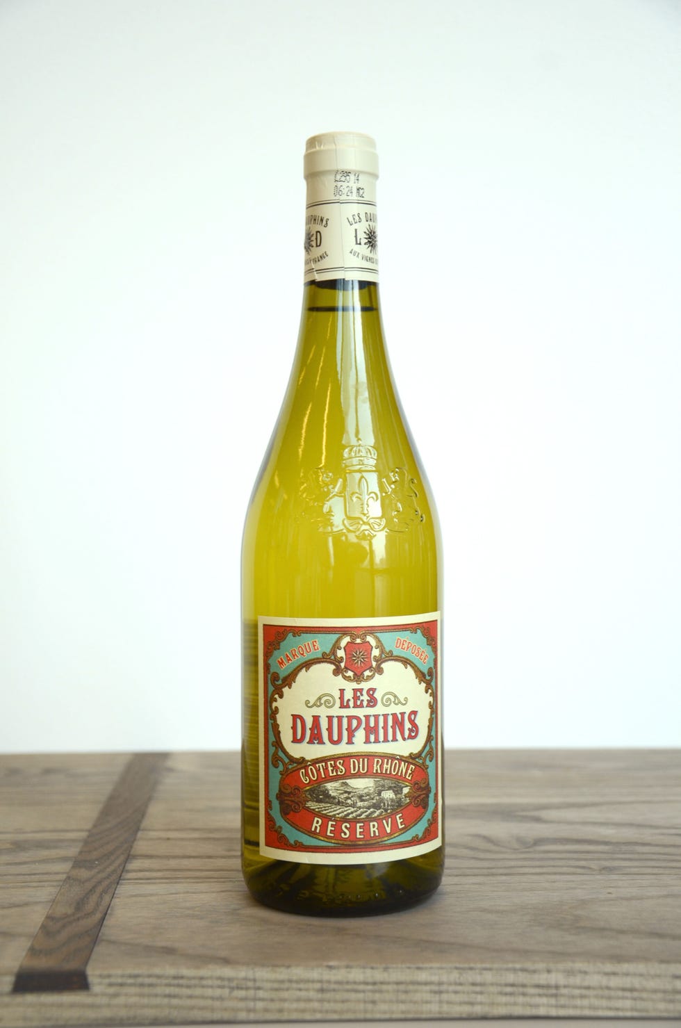 Glass bottle, Product, Wood, Bottle, Liquid, Alcohol, Alcoholic beverage, Ingredient, Logo, Black, 