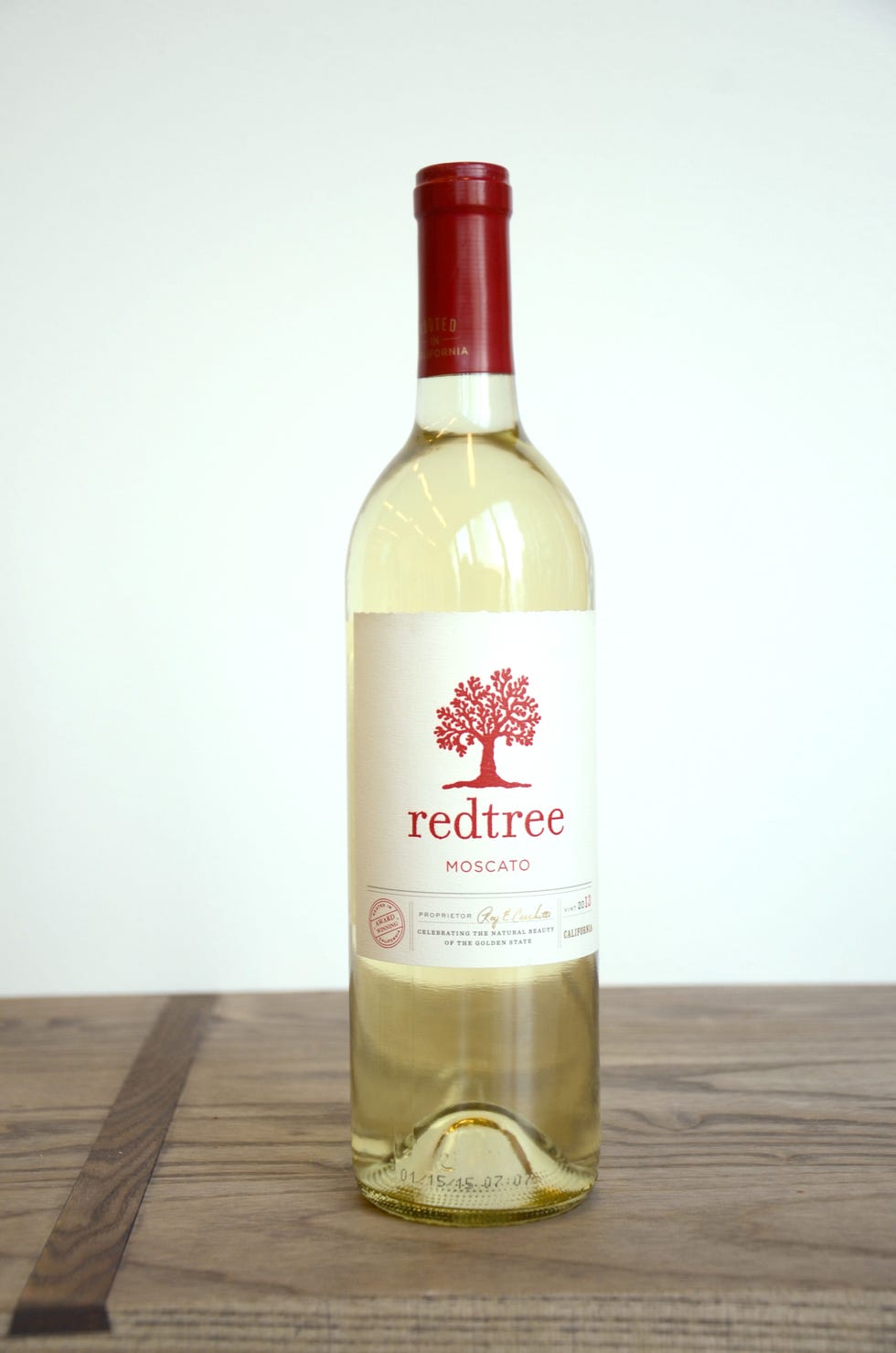 Glass bottle, Wood, Liquid, Bottle, Drink, Alcoholic beverage, Alcohol, Fluid, Glass, Wine bottle, 