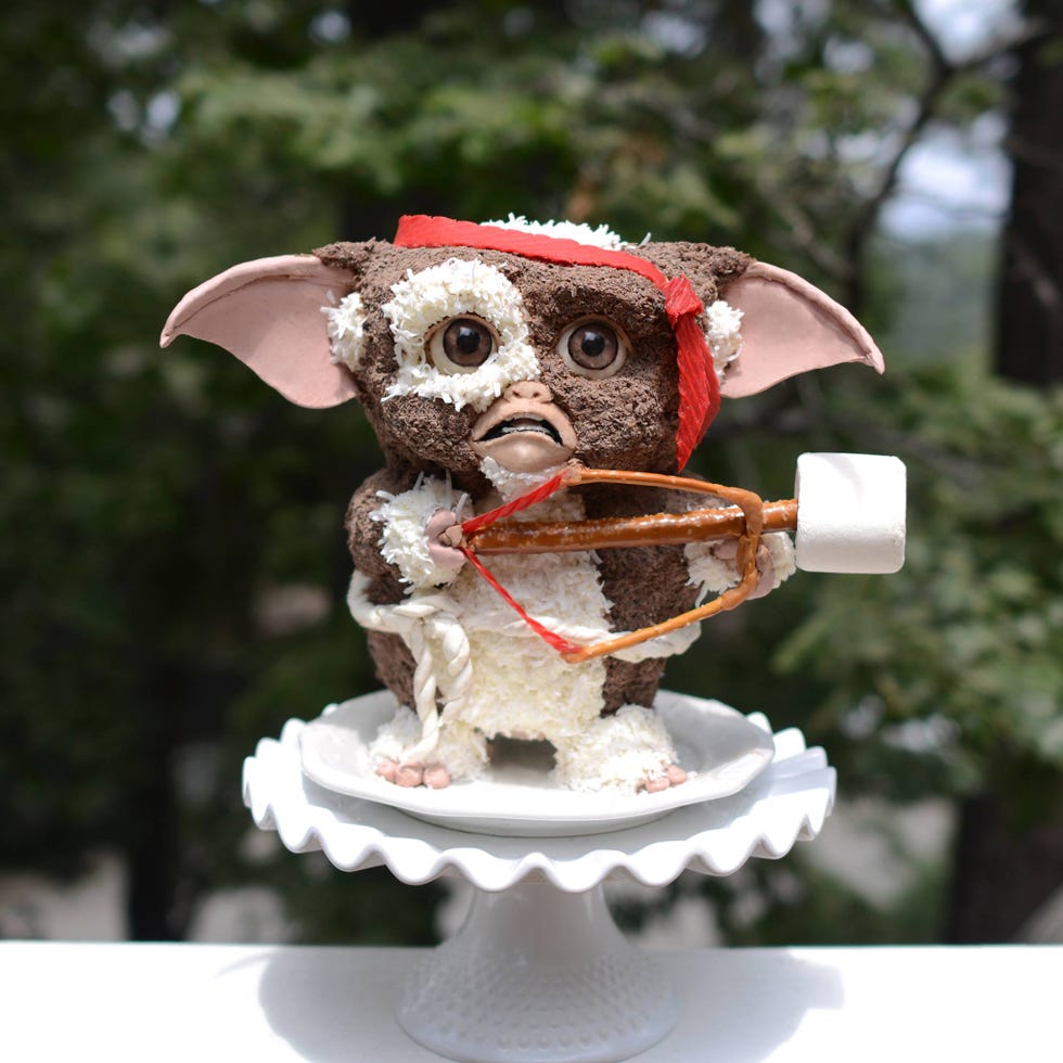 Toy, Snout, Lawn ornament, Sculpture, Figurine, Macaque, Primate, Fictional character, Animal figure, Working animal, 