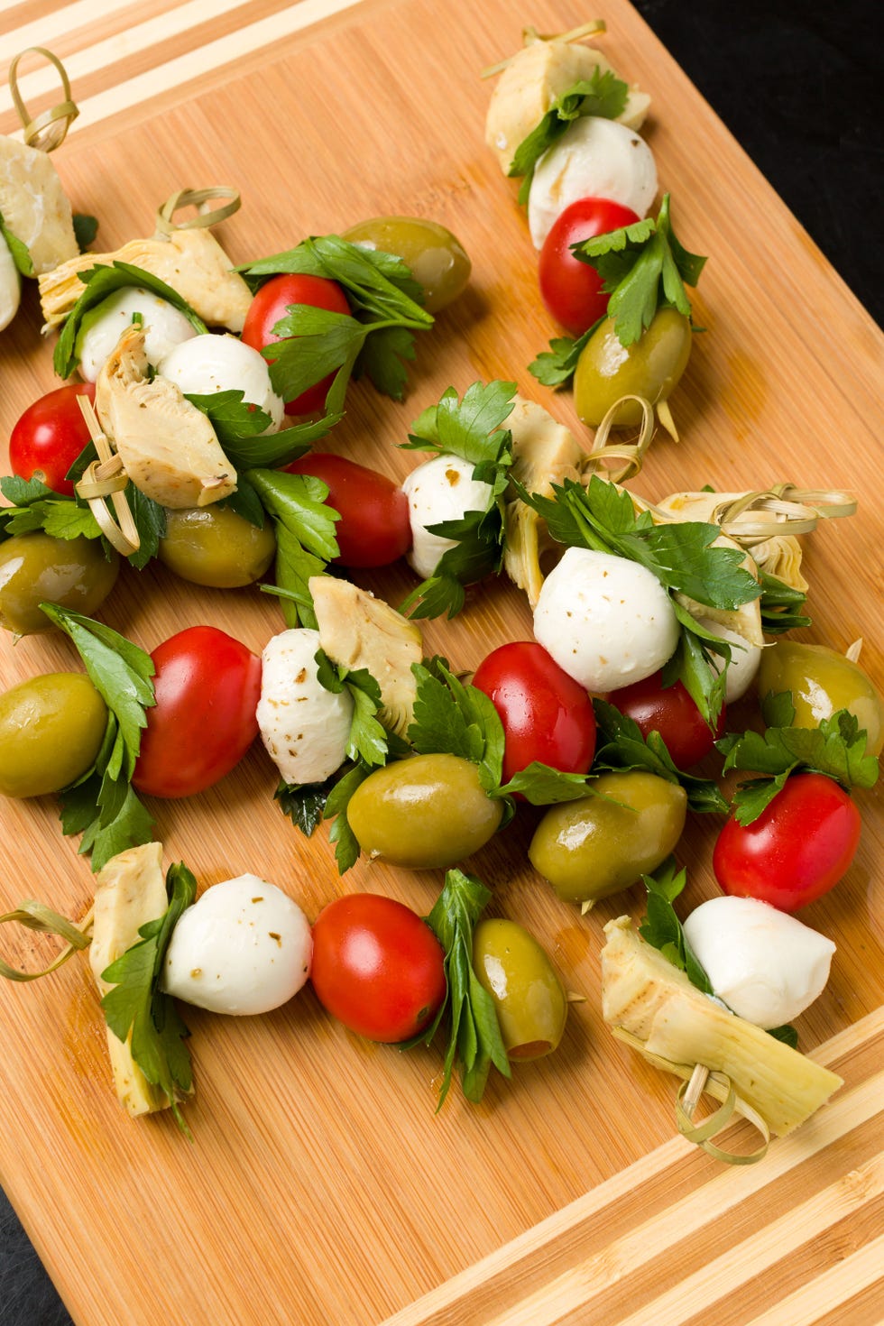 <p>You know olives are essential for cocktail hour—now make them addictive by spearing them with marinated artichokes, mozzarella balls, and tomatoes.
</p><p>Get the recipe on <a target="_blank" href="http://gogonow.org/entertaining/tabletop/recipes/a44516/antipasti-skewers-recipe/?visibilityoverride">Delish</a>.<br></p>