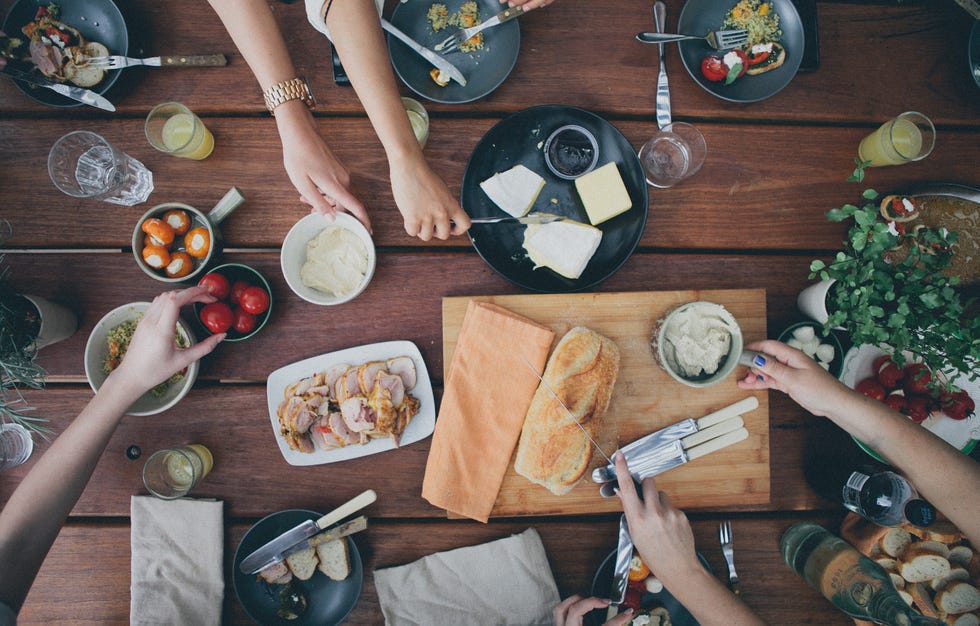 Friends eating food at table