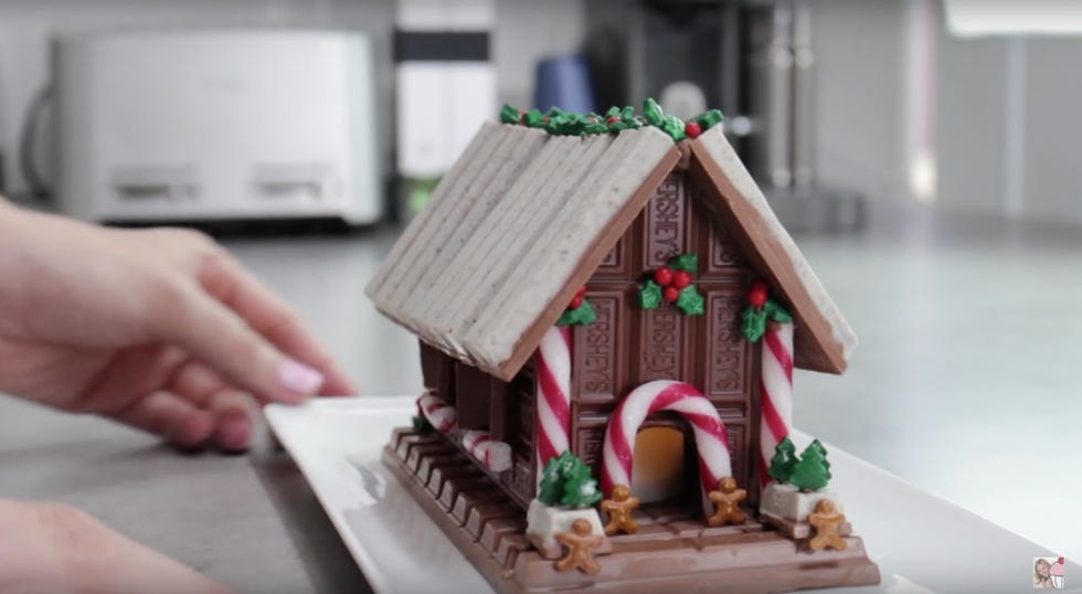 Finger, Hand, Gingerbread house, Nail, House, Toy, Dessert, Gingerbread, Christmas decoration, Christmas, 
