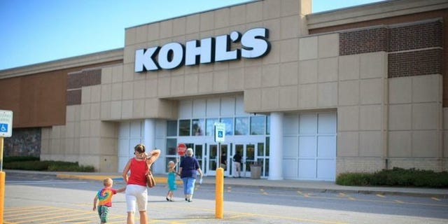 Clothing, Commercial building, Public space, Real estate, Logo, Sidewalk, Luggage and bags, Signage, Retail, Pedestrian, 