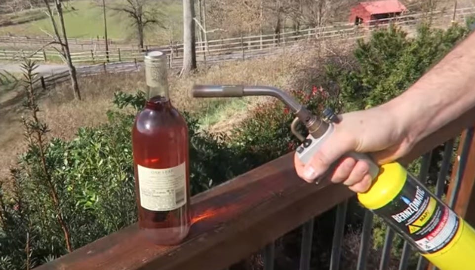 Fluid, Bottle, Red, Liquid, Wood stain, Coquelicot, Glass bottle, Alcohol, Bicycle accessory, Distilled beverage, 