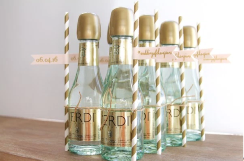 Liquid, Bottle, Glass bottle, Teal, Beige, Cylinder, Cork, Label, Packaging and labeling, 
