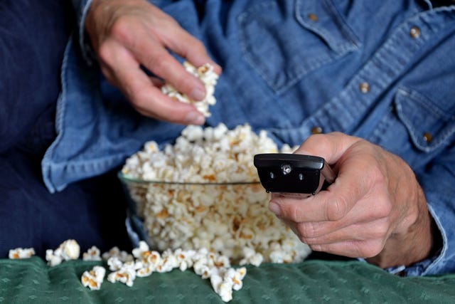 Finger, Denim, Hand, Wrist, Popcorn, Nail, Thumb, Kettle corn, Mobile phone, Gadget, 